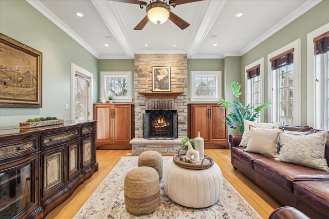 2423 Harrison St, Evanston, IL 60201 - living room with light wood-style floors, a fireplace, a ceiling fan, crown molding, and recessed lighting