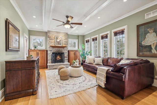 2423 Harrison St, Evanston, IL 60201 - living area with healthy amount of natural light, light wood-style floors, ceiling fan, recessed lighting, and crown molding