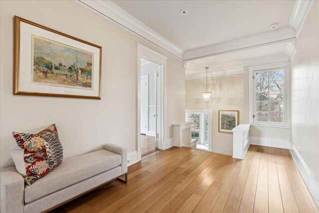 2423 Harrison St, Evanston, IL 60201 - sitting room featuring wood-type flooring, crown molding, baseboards, and an upstairs landing