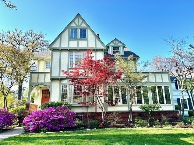 2423 Harrison St, Evanston, IL 60201 - view of front of property featuring a front lawn and stucco siding