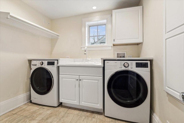 2423 Harrison St, Evanston, IL 60201 - laundry room featuring washer / clothes dryer, cabinet space, and baseboards