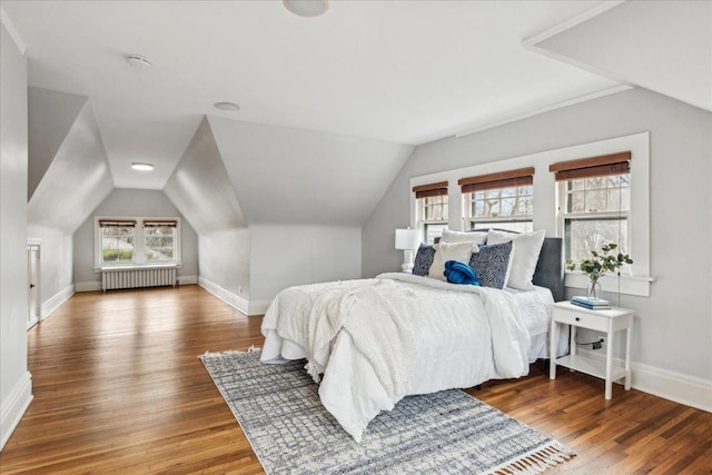 2423 Harrison St, Evanston, IL 60201 - bedroom with radiator, baseboards, wood finished floors, and lofted ceiling