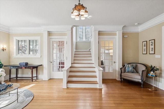 2423 Harrison St, Evanston, IL 60201 - foyer featuring stairs, hardwood / wood-style floors, ornamental molding, a chandelier, and baseboards