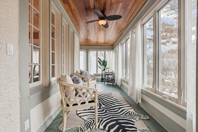 2423 Harrison St, Evanston, IL 60201 - sunroom / solarium featuring wood ceiling, healthy amount of natural light, ceiling fan, wood finished floors, and crown molding