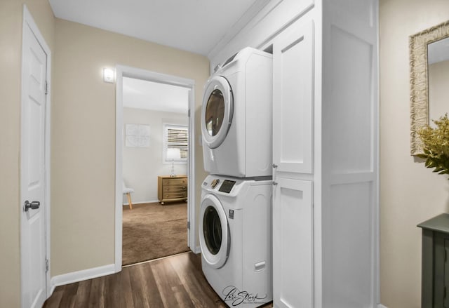 3816 N Washington St, Westmont, IL 60559 - laundry room featuring stacked washer and clothes dryer, dark wood-style floors, and cabinet space