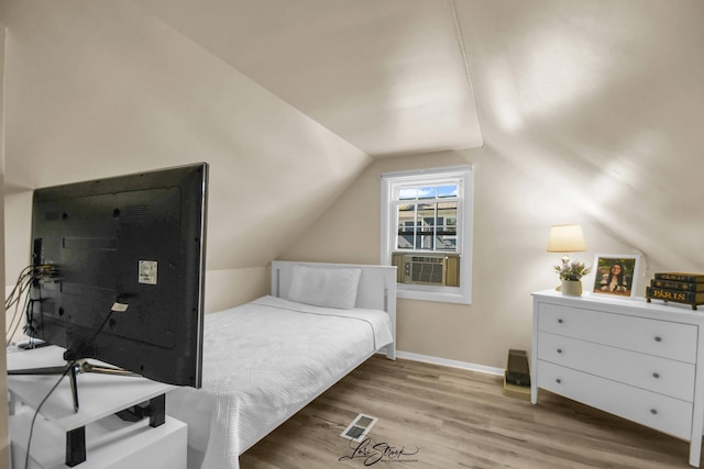3816 N Washington St, Westmont, IL 60559 - bedroom featuring cooling unit, light wood finished floors, and vaulted ceiling