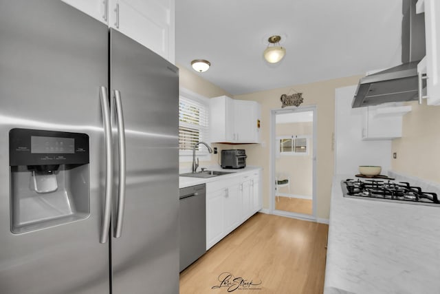 3816 N Washington St, Westmont, IL 60559 - kitchen with appliances with stainless steel finishes, wall chimney exhaust hood, white cabinets, and light countertops
