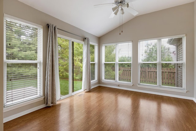 726 W Trl, Grayslake, IL 60030 - unfurnished sunroom with baseboards, vaulted ceiling, and wood finished floors