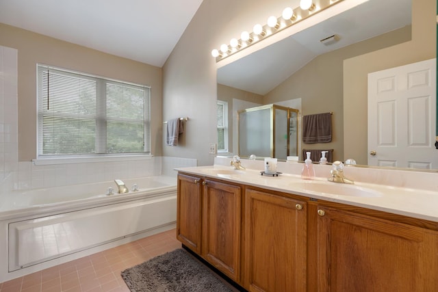 726 W Trl, Grayslake, IL 60030 - full bath featuring vaulted ceiling, a stall shower, a bath, double vanity, and tile patterned floors