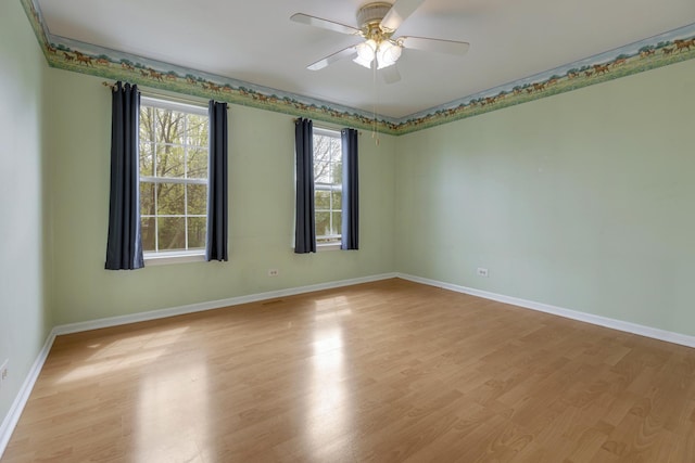 726 W Trl, Grayslake, IL 60030 - spare room featuring baseboards, light wood-style floors, and ceiling fan