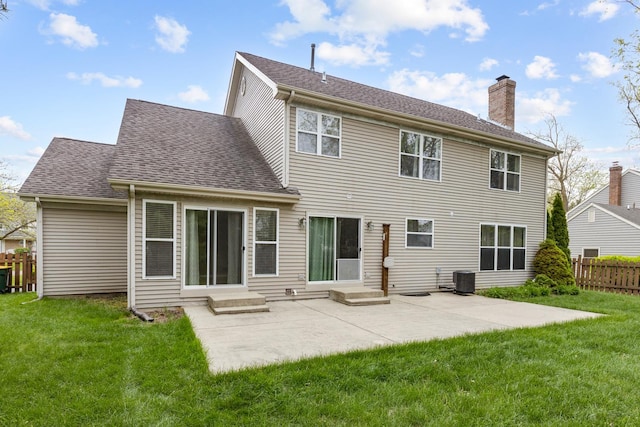726 W Trl, Grayslake, IL 60030 - back of property with entry steps, a chimney, a patio, central AC, and a shingled roof