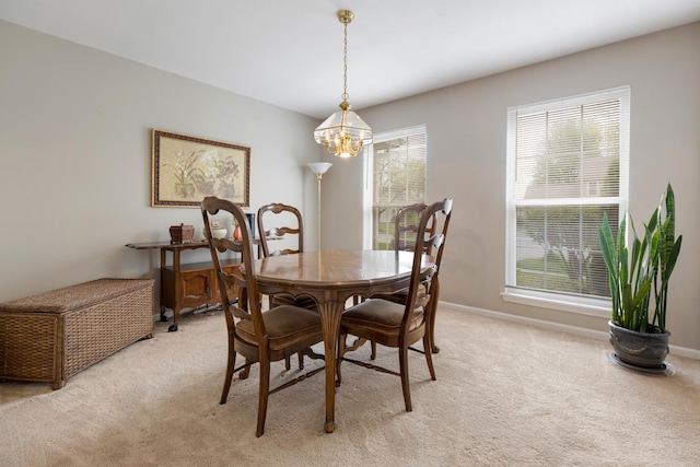 726 W Trl, Grayslake, IL 60030 - dining room featuring light colored carpet, a chandelier, and baseboards