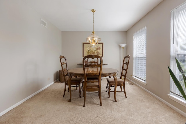 726 W Trl, Grayslake, IL 60030 - dining space featuring light carpet, healthy amount of natural light, and baseboards