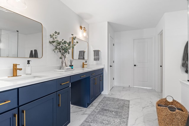 bathroom with marble look tile flooring and double vanity