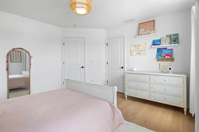 bedroom with light wood-type flooring