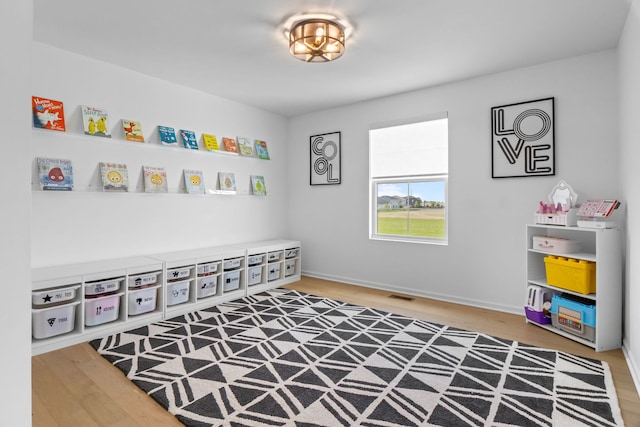 rec room with wood finished floors
