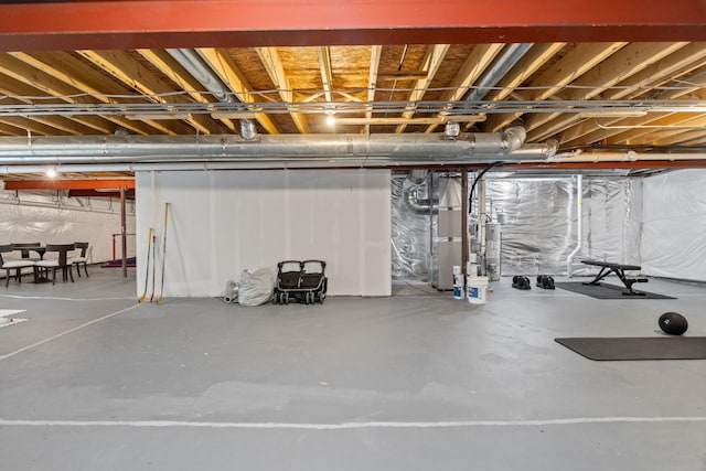 unfinished below grade area featuring heating unit