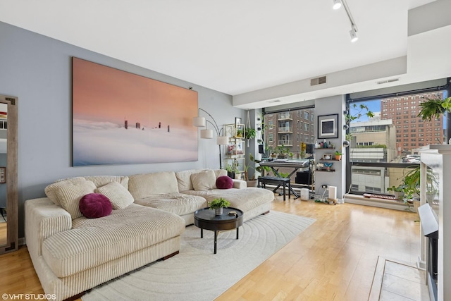 1212 N Wells St Unit 402, Chicago, IL 60610 - living area with wood finished floors and track lighting