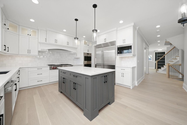 622 S Euclid Ave, Elmhurst, IL 60126 - kitchen featuring gray cabinetry, built in appliances, white cabinetry, light wood-style floors, and recessed lighting