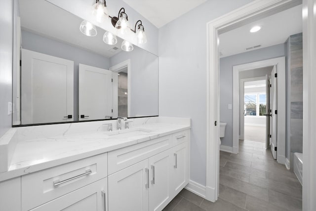 622 S Euclid Ave, Elmhurst, IL 60126 - bathroom with toilet, baseboards, vanity, and recessed lighting