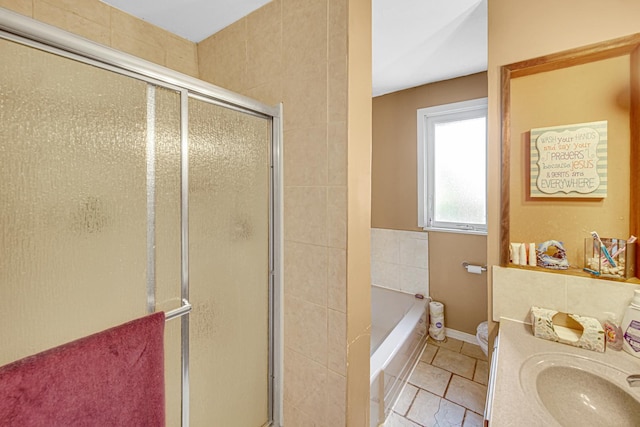 2748 Bellwood Ave, Melrose Park, IL 60164 - full bathroom featuring a shower stall, a bath, tile patterned floors, baseboards, and vanity