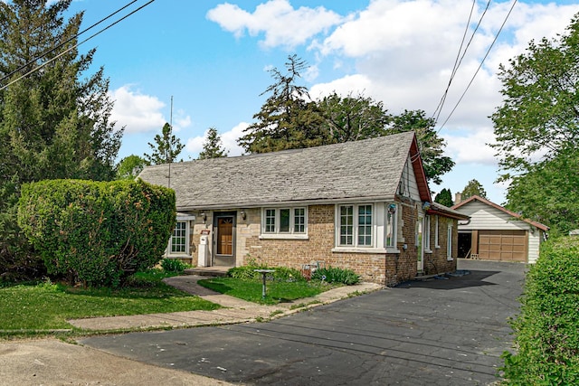 2748 Bellwood Ave, Melrose Park, IL 60164 - view of front of house with brick siding, an outdoor structure, and a garage