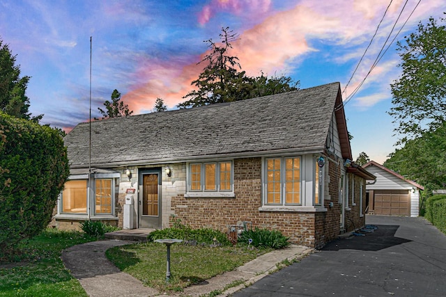 2748 Bellwood Ave, Melrose Park, IL 60164 - view of front facade featuring brick siding, an outbuilding, and a garage
