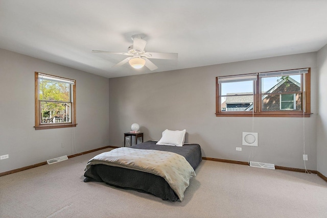 bedroom featuring carpet flooring, baseboards, and ceiling fan
