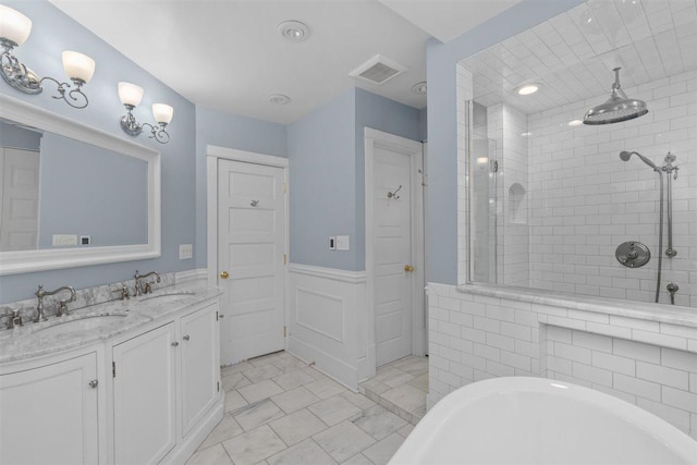 794 Dean Ave, Highland Park, IL 60035 - full bathroom featuring wainscoting, a tile shower, double vanity, and a tub