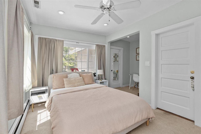 794 Dean Ave, Highland Park, IL 60035 - bedroom with light carpet, an AC wall unit, a baseboard radiator, recessed lighting, and ceiling fan