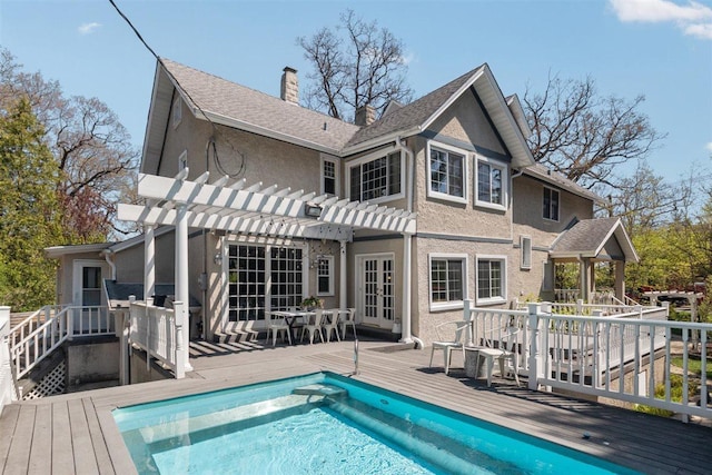 794 Dean Ave, Highland Park, IL 60035 - rear view of house featuring a pergola, a wooden deck, a chimney, and an outdoor pool