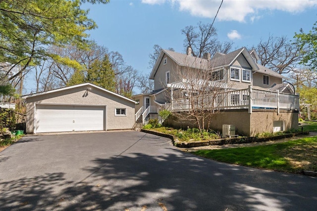 794 Dean Ave, Highland Park, IL 60035 - view of side of property featuring a garage and stucco siding