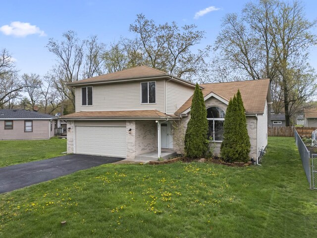 16215 S Trumbull Ave S, Markham, IL 60428 - view of front facade featuring an attached garage, asphalt driveway, and brick siding