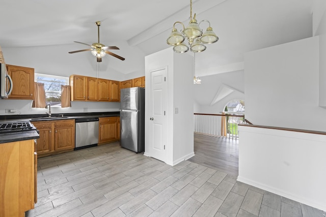 16215 S Trumbull Ave S, Markham, IL 60428 - kitchen with appliances with stainless steel finishes, a sink, lofted ceiling, a chandelier, and a ceiling fan