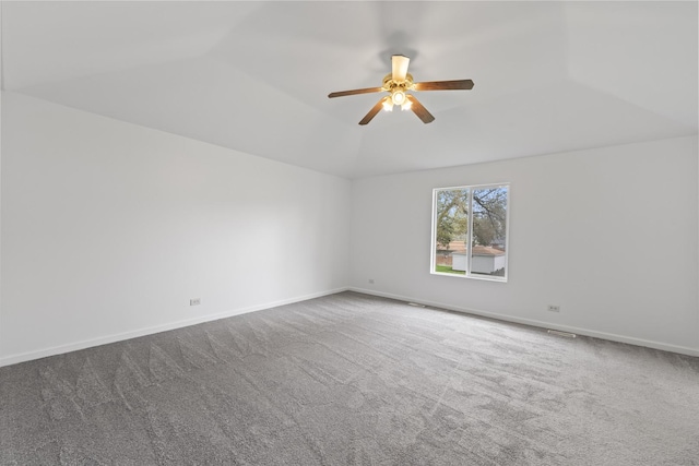 16215 S Trumbull Ave S, Markham, IL 60428 - empty room with carpet flooring, ceiling fan, vaulted ceiling, and baseboards