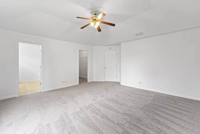 16215 S Trumbull Ave S, Markham, IL 60428 - unfurnished bedroom with carpet flooring, a walk in closet, baseboards, and a ceiling fan