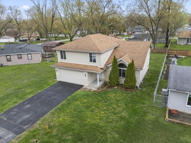 16215 S Trumbull Ave S, Markham, IL 60428 - view of front facade with an attached garage, a residential view, and driveway