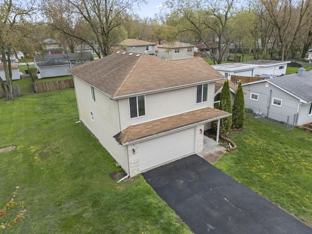 16215 S Trumbull Ave S, Markham, IL 60428 - view of front of property featuring a shingled roof, an attached garage, driveway, and a front yard