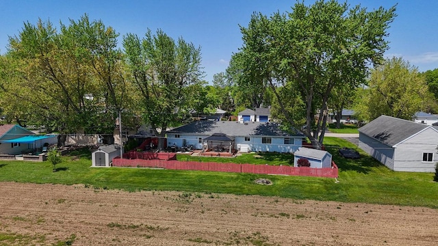 23424 W Winston Ave, Plainfield, IL 60586 - back of house with a gazebo, a storage unit, an outdoor structure, and a lawn