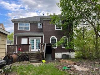 back of house featuring a deck