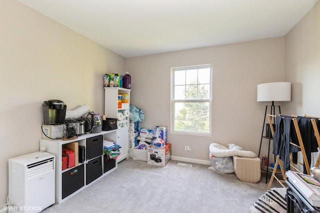 rec room with carpet floors and baseboards