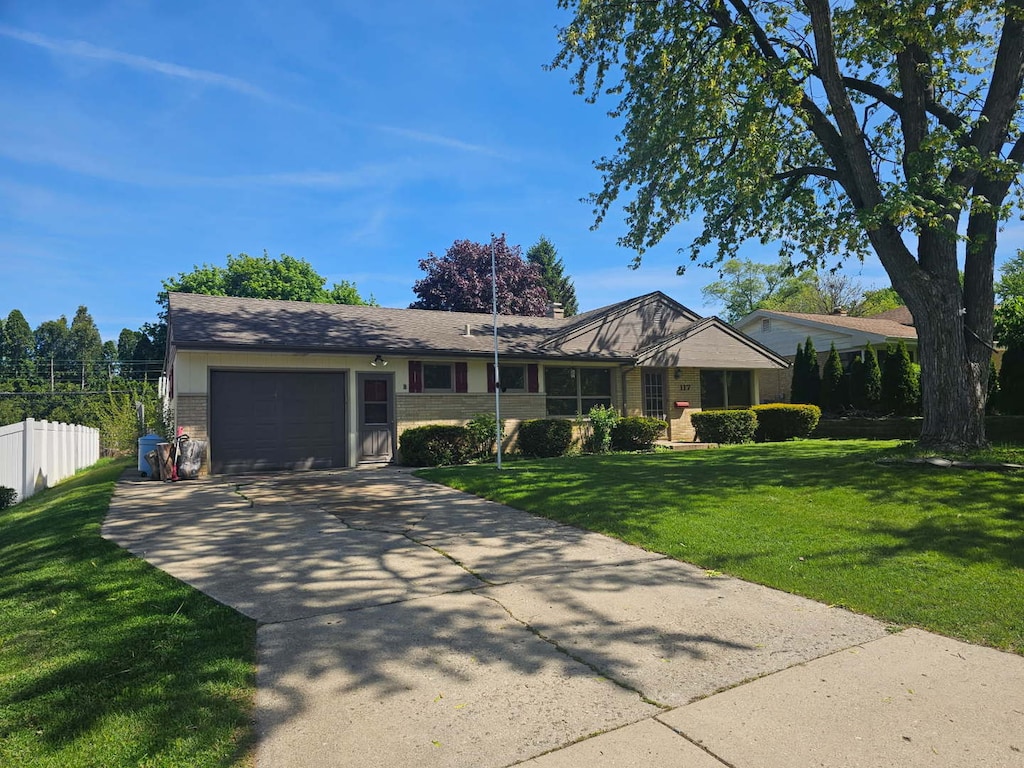 117 April Ln, North Aurora, IL 60542 - ranch-style house featuring an attached garage, concrete driveway, and brick siding