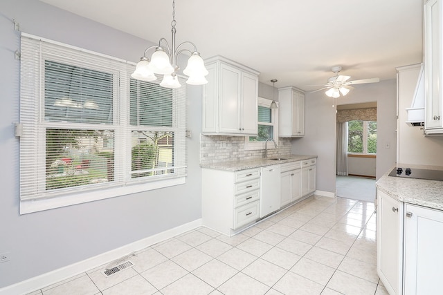 1116 N Old Fence Rd, Addison, IL 60101 - kitchen featuring white dishwasher, black electric stovetop, a ceiling fan, a chandelier, and decorative backsplash