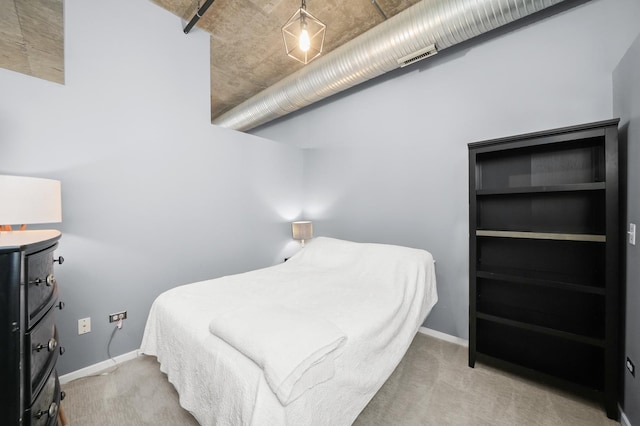 bedroom featuring carpet flooring and baseboards