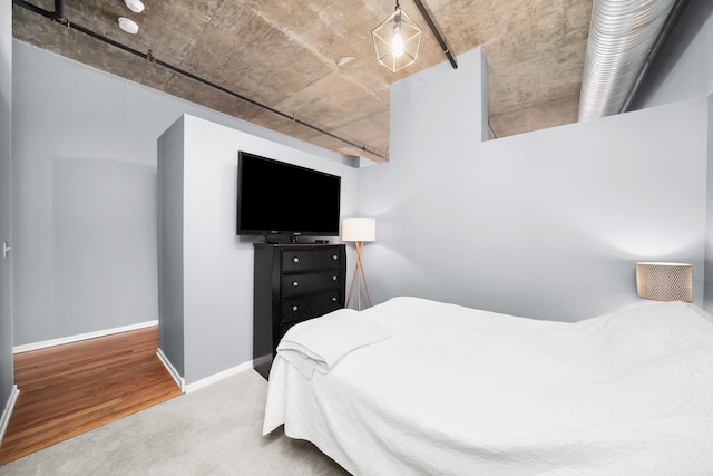 carpeted bedroom with baseboards