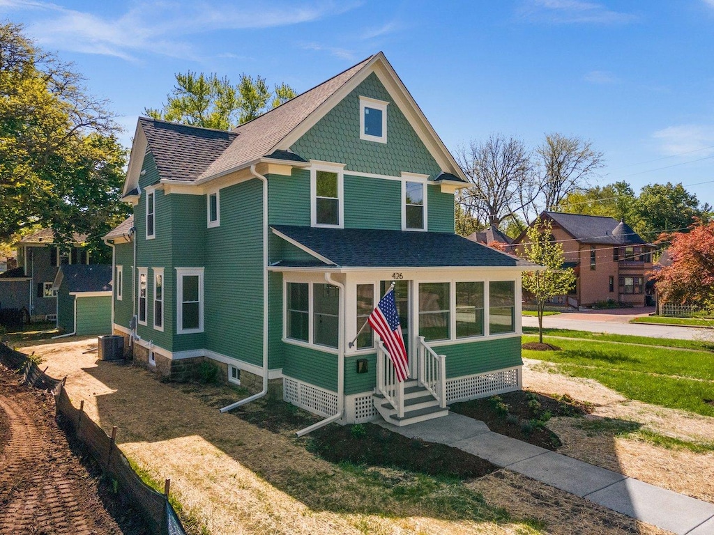 426 S Jefferson St, Batavia, IL 60510 - victorian house with entry steps, roof with shingles, and central AC