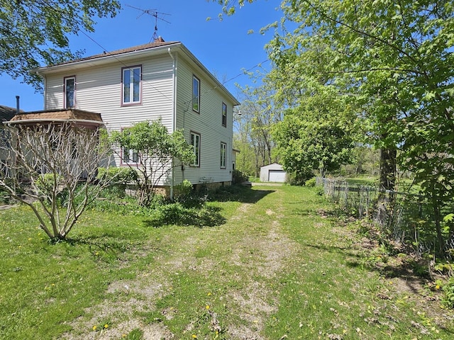 rear view of property featuring a garage