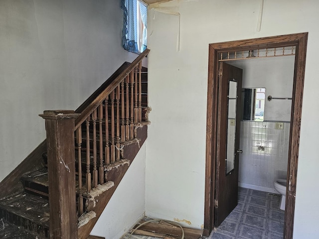 stairs featuring tile patterned floors
