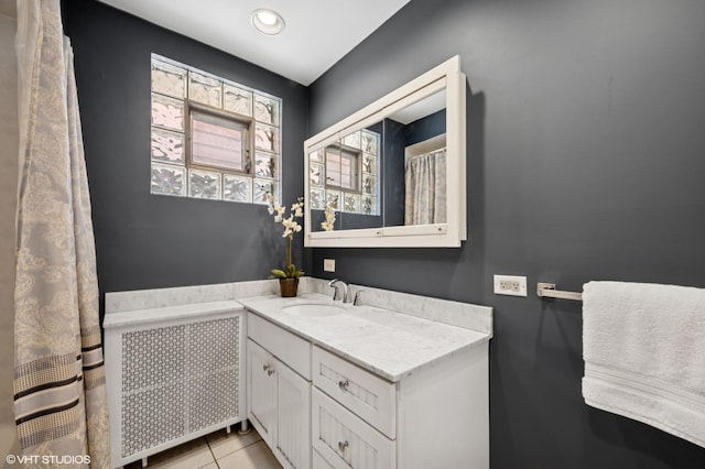 6329 N Hermitage Ave, Chicago, IL 60660 - bathroom with vanity and tile patterned flooring