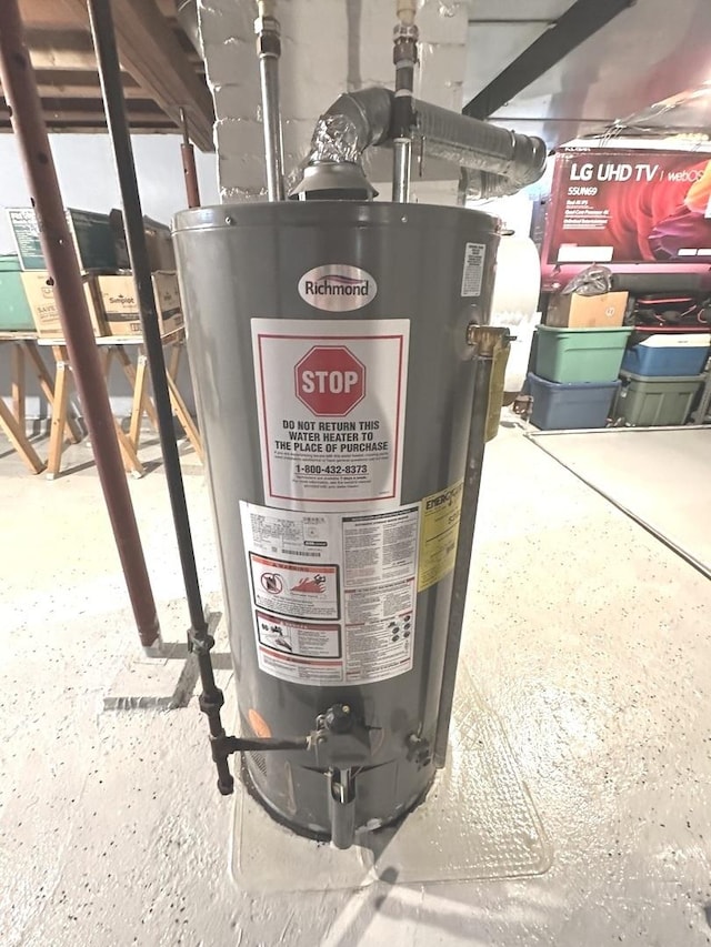 210 W S St, Sheffield, IL 61361 - utility room with water heater